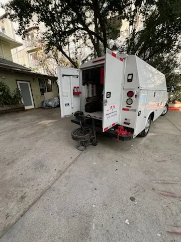 Magnet Plumbing service vehicle on-site for Grease Trap Cleaning in Riviera Beach